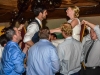 bride-and-groom-lifted-up-in-chairs-to-sounds-of-detroit-wedding-band