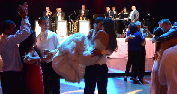 Bride and Groom Kiss to Sounds of Best Detroit Wedding Band